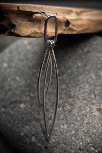 Sleek minimal design leaf shape outline double dangle stud earrings, handmade in recycled silver by Becky Crawford in Devon, UK. - Image 4