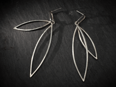 Sleek minimal design leaf shape outline double dangle stud earrings, handmade in recycled silver by Becky Crawford in Devon, UK. - Image 2