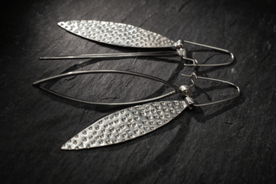 Long dangly silver leaf shape earrings, textured and outline. Dimpled texture handmade from recycled silver in Devon, UK - Image 3